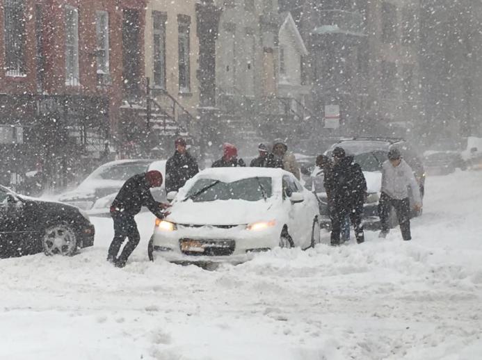 Digging out a stuck car on Snowmageddon Day in Bed-Stuy Digging out a stuck car